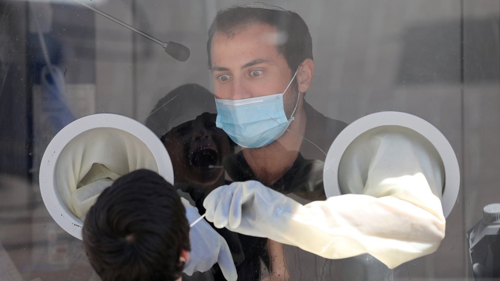 Medical team of Maccabi Health Services takes swab samples at a test station in Modi"in near Jerusalem, Israel, 13 September 2020