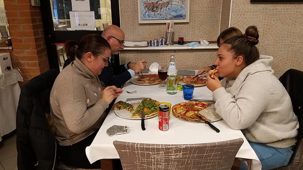 Eating pizza indoors at Tentazioni pizzeria in Pianora just outside Bologna