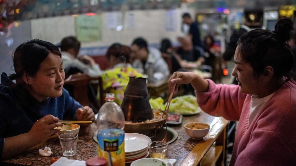 People eating at a Beijing restaurant