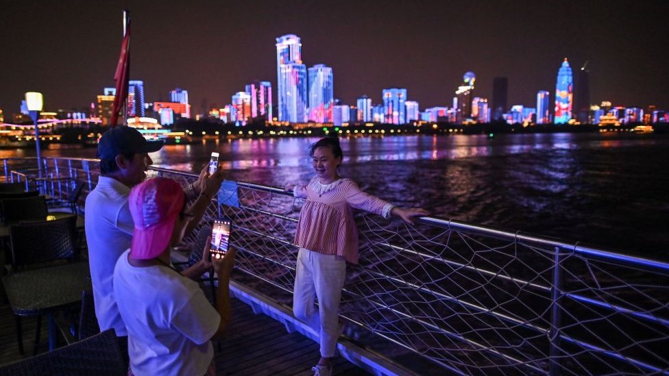 Tourists at the riverfront in Wuhan