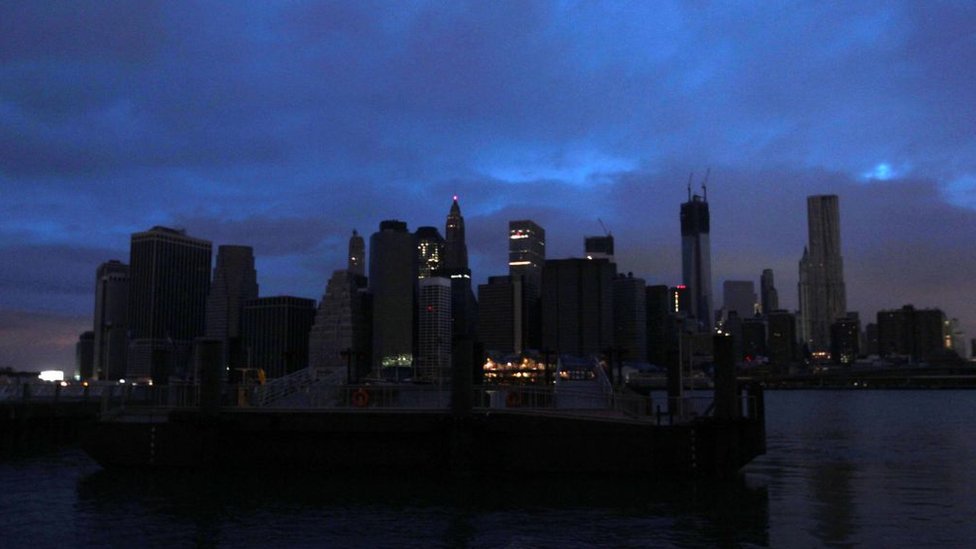 The darkened skyline of lower Manhattan is seen one day after Hurricane Sandy on October 30, 2012