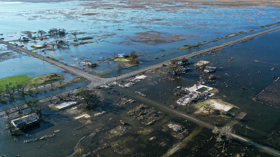 Flood waters from Hurricane Delta surrounding buildings which had been destroyed by August's Hurricane Laura. October 10, 2020 in Creole, Louisiana