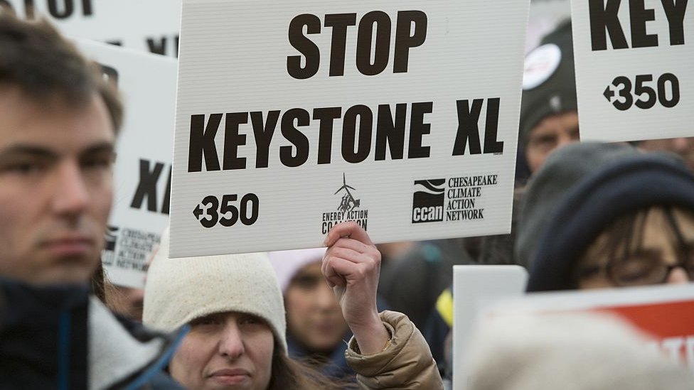 Opponents of the Keystone XL and Dakota Access pipelines hold a rally as they protest Donald Trump's executive orders advancing their construction in 2017