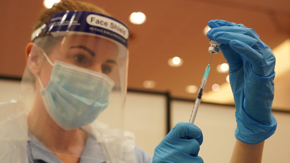 A woman preparing a vaccine at the Centre for Life in Newcastle