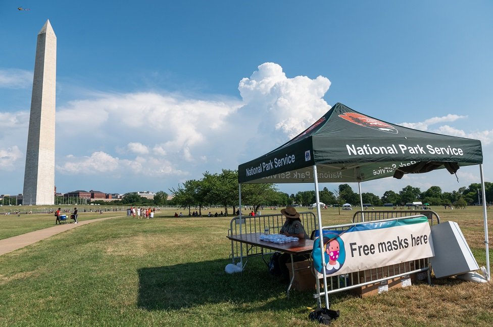 The US National Park Service offers free masks on the National Mall in Washington, DC, ahead of the July 4, 2020, Independence Day celebrations.