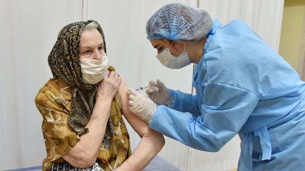 A woman is vaccinated in Ukraine