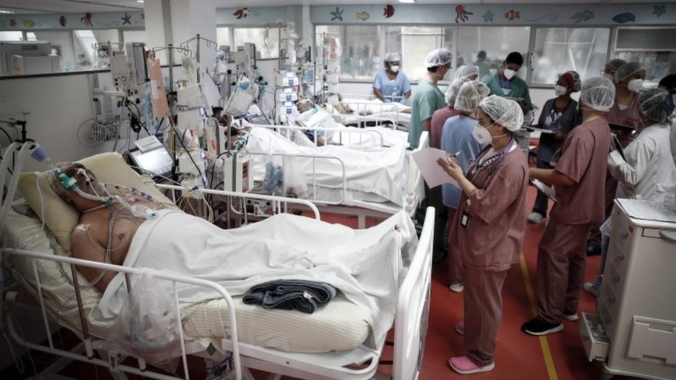 Medical personnel work at the ICU of the M'Boi Mirim Hospital, outskirts of Sao Paulo, Brazil, 12 March 202