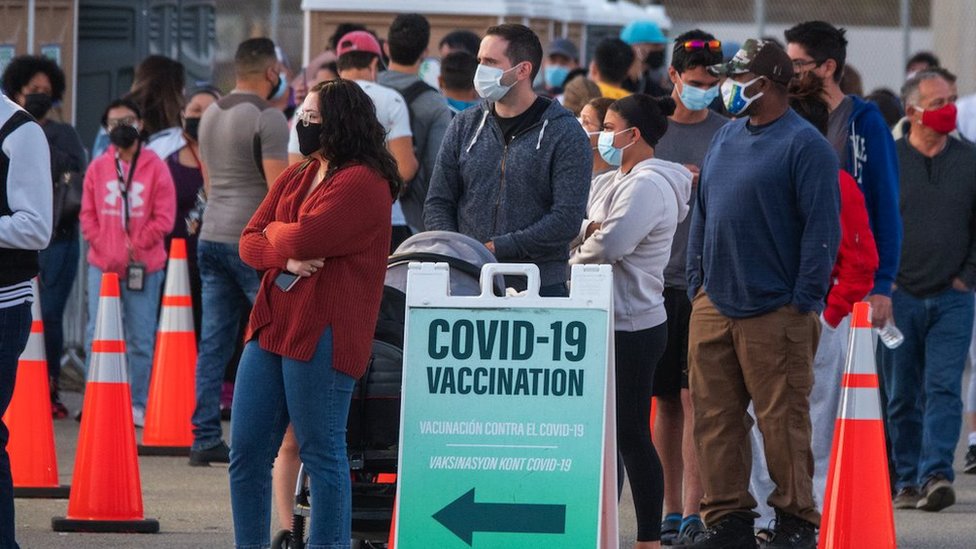 People queue in a line to get the COVID-19 Vaccine in Miami, Florida, 5 April 2021