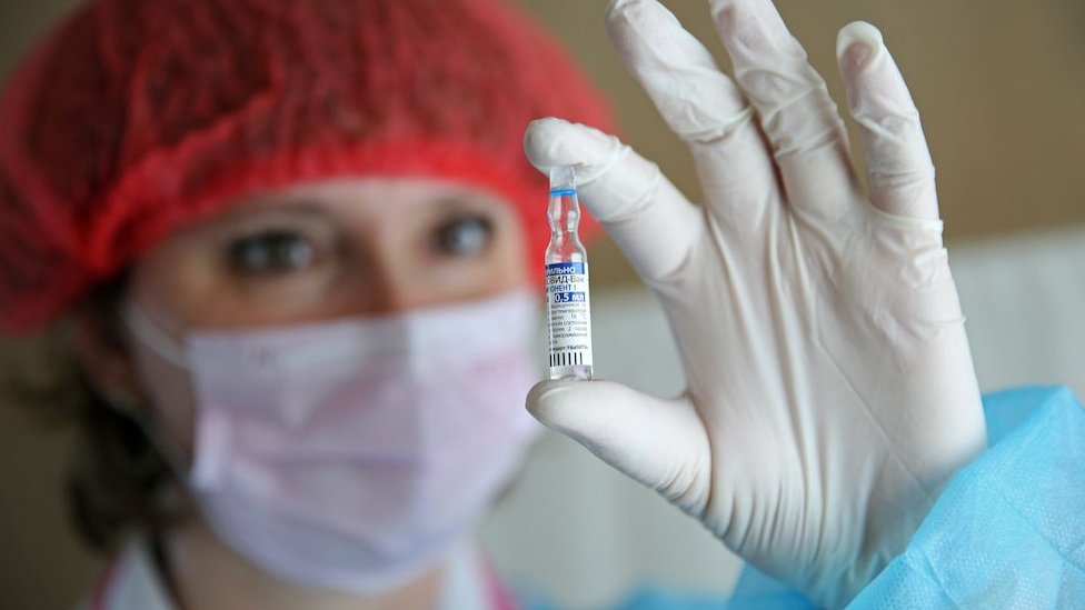 A medical worker in Russia prepares a dose of COVID-19 vaccine