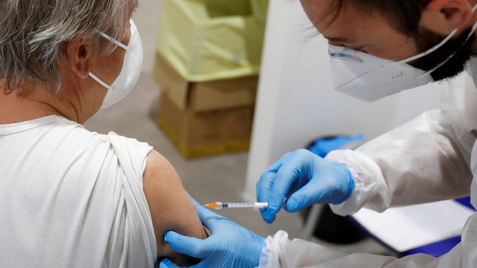 A person receives a dose of the Moderna vaccine against the coronavirus disease (COVID-19) at the Music Auditorium in Rome, Italy, April 14, 2021.