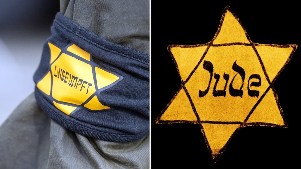 A Berlin protester wore a yellow star with the word "unvaccinated", mimicking the notorious badges the Nazis forced to wear in World War Two