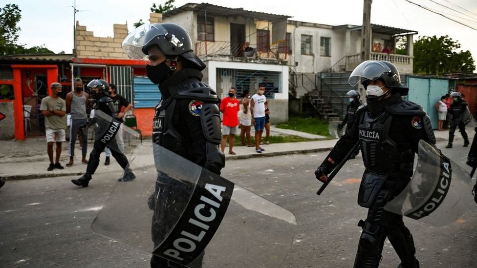 Police patrol a suburb of Havana after anti-government unrest, July 2021