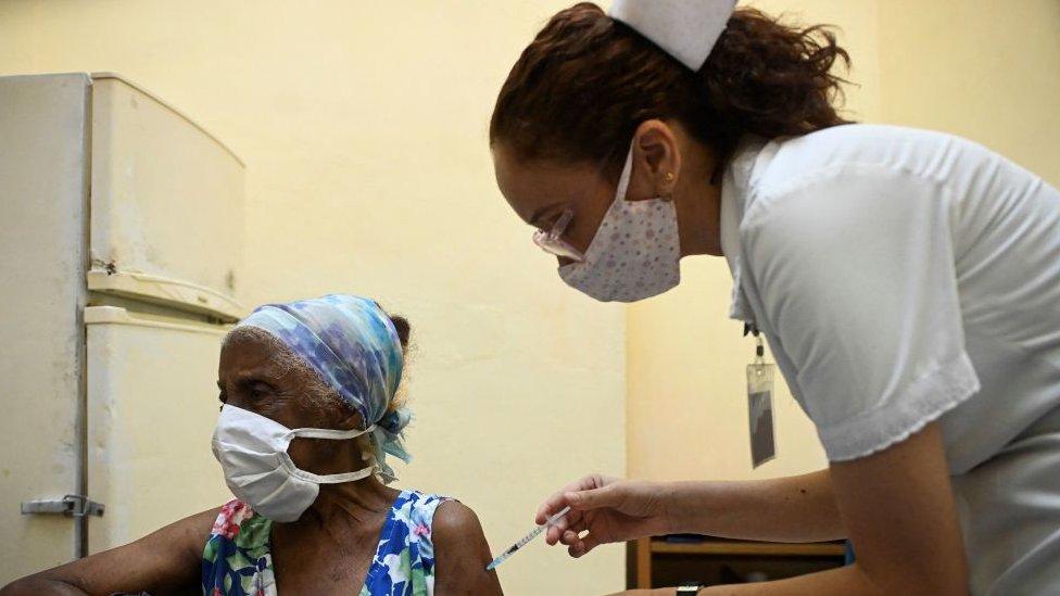 A nurse vaccinates an elderly woman against COVID-19 with Cuban vaccine Abdala in Havana, on August 2, 2021