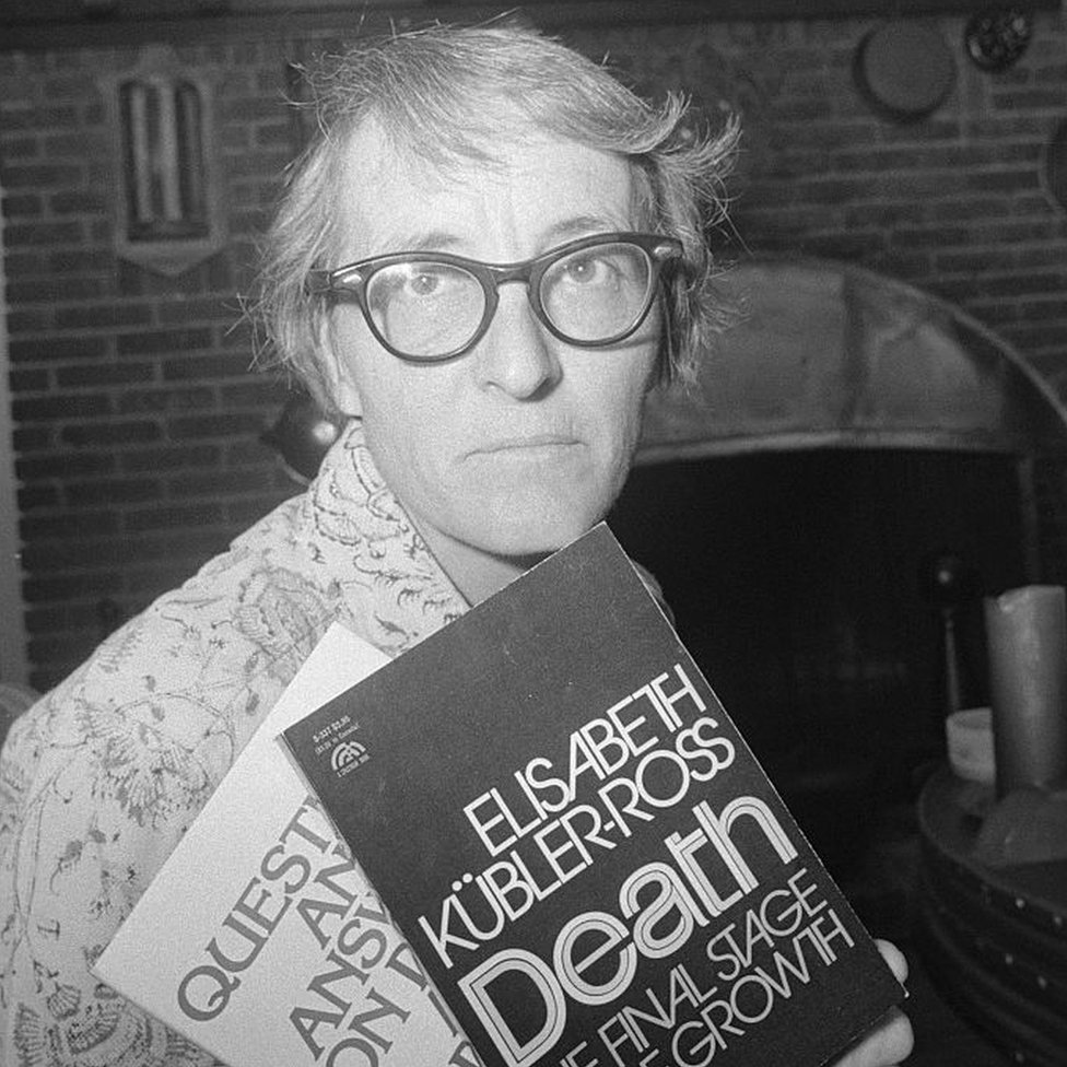 Elisabeth Kübler-Ross holding two of her books