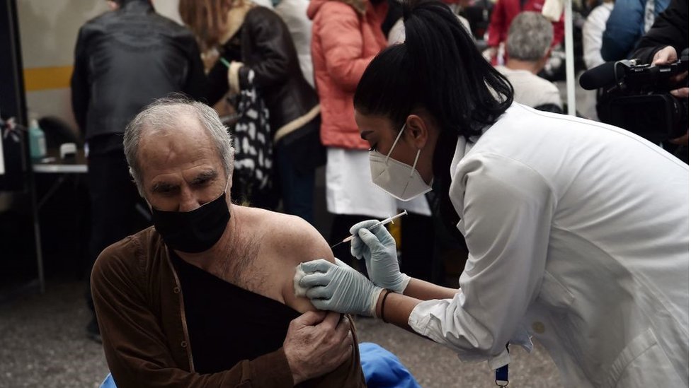 A patient receives a dose of vaccine against Covid-19, in Aristotelous Square, in the center of Thessaloniki