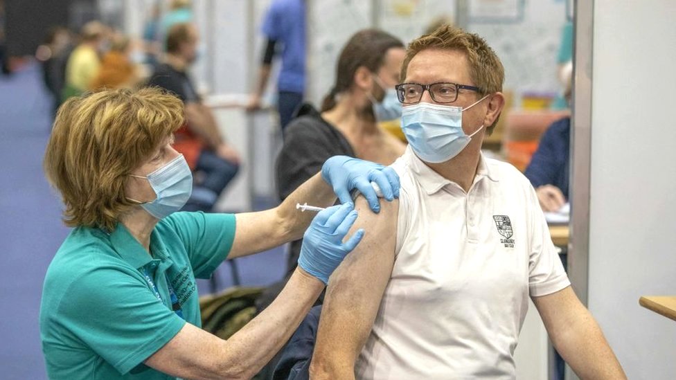 Man receiving vaccination at centre in Belfast