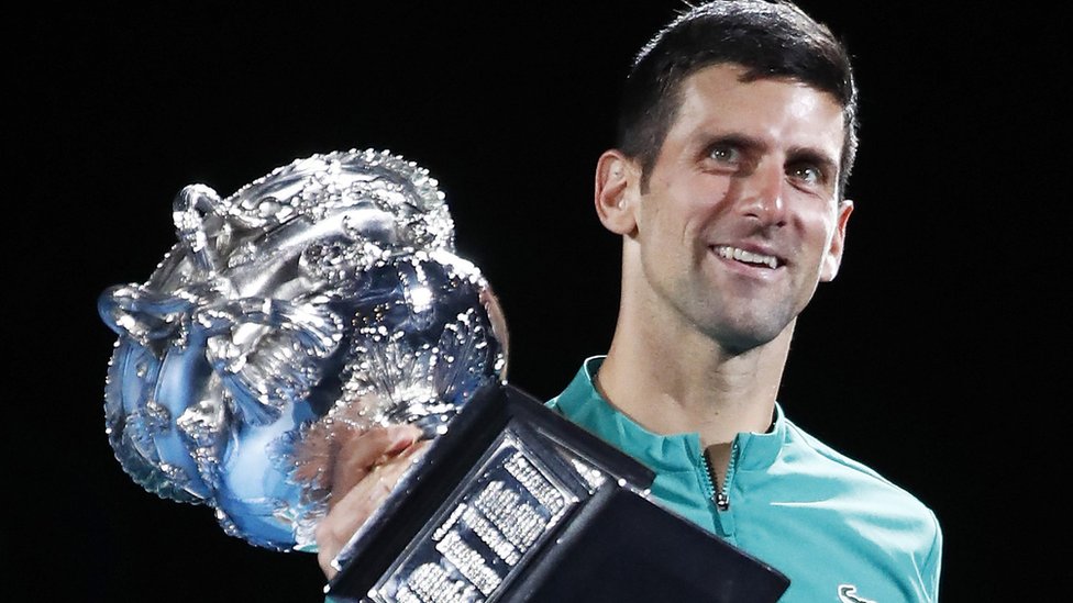 Novak Djokovic lifting the trophy at the 2021 Australian Open
