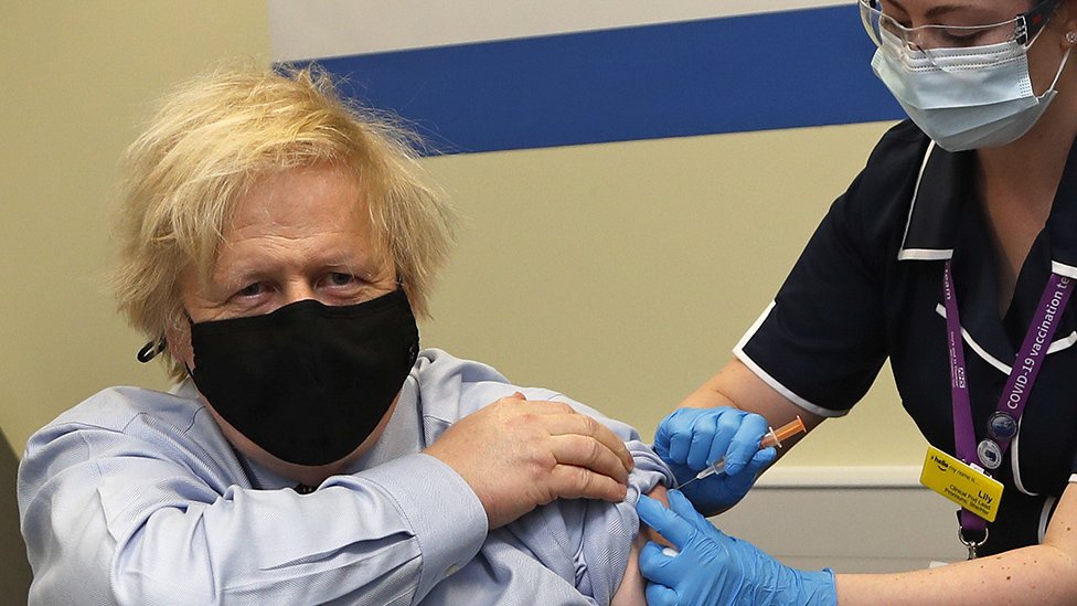 MARCH 19: Britain's Prime Minister Boris Johnson receives the first dose of the AstraZeneca vaccine administered by nurse and Clinical Pod Lead, Lily Harrington at St.Thomas' Hospital on March 19, 2021 in London, England