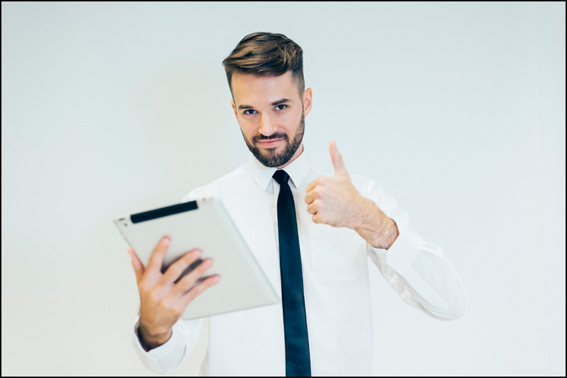 man with tablet thumbs up 1